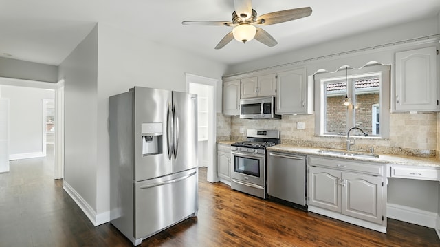 1836 Cuyler Ave, Berwyn, IL 60402 - kitchen with appliances with stainless steel finishes, tasteful backsplash, ceiling fan, light stone counters, and dark wood-type flooring