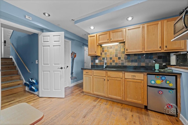 4756 Flanders Ct, Plainfield, IL 60586 - kitchen featuring appliances with stainless steel finishes, decorative backsplash, light wood-style floors, and recessed lighting