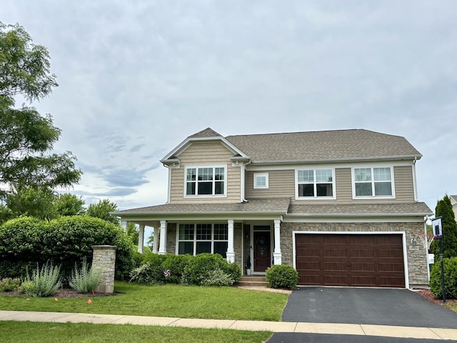 14924 S Case St, Plainfield, IL 60544 - craftsman-style house featuring driveway, an attached garage, a front lawn, roof with shingles, and stone siding