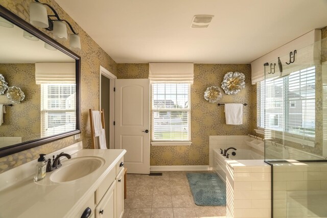 14924 S Case St, Plainfield, IL 60544 - full bathroom with wallpapered walls, vanity, healthy amount of natural light, a bath, and tile patterned floors
