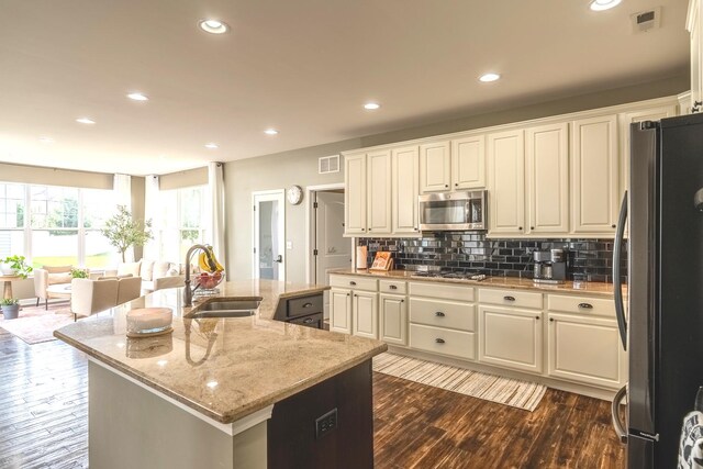 14924 S Case St, Plainfield, IL 60544 - kitchen featuring stainless steel appliances, dark wood-style floors, white cabinets, backsplash, and recessed lighting