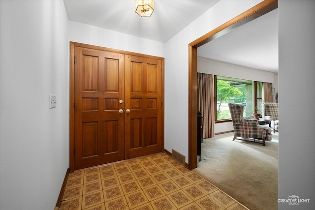 2290 Copley St, Aurora, IL 60506 - foyer with baseboards and carpet