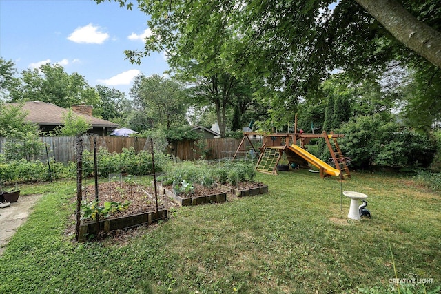 2290 Copley St, Aurora, IL 60506 - fenced backyard featuring a garden and a playground