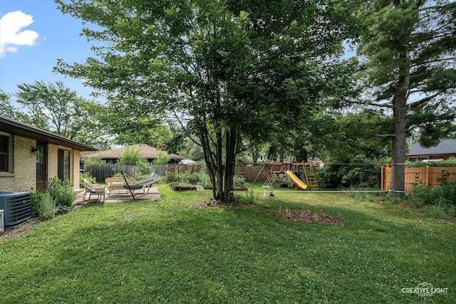2290 Copley St, Aurora, IL 60506 - fenced backyard featuring a playground and a patio