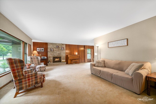 2290 Copley St, Aurora, IL 60506 - living area with wooden walls, light colored carpet, and a fireplace