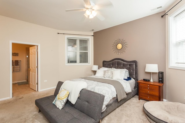 4124 N Kenmore Ave Unit Gs, Chicago, IL 60613 - bedroom featuring light colored carpet, multiple windows, a ceiling fan, and ensuite bath