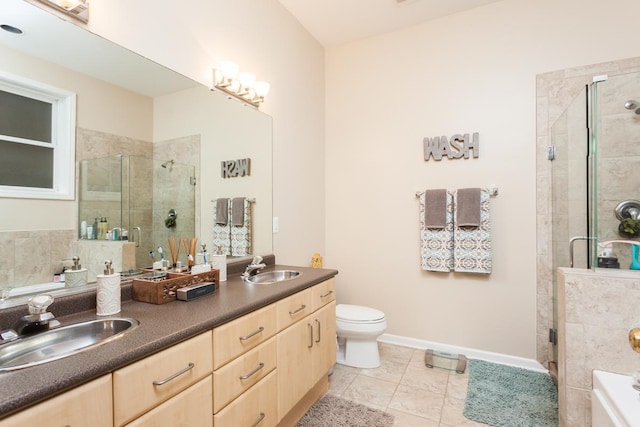 4124 N Kenmore Ave Unit Gs, Chicago, IL 60613 - bathroom featuring a stall shower, double vanity, a garden tub, and tile patterned floors