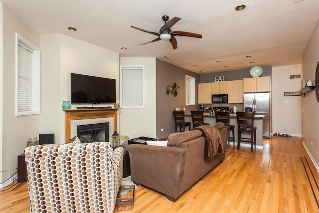 4124 N Kenmore Ave Unit Gs, Chicago, IL 60613 - living area with a ceiling fan, light wood-style flooring, a fireplace, and recessed lighting