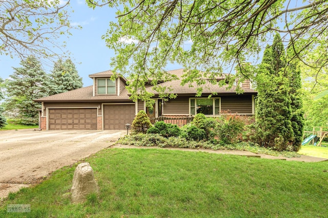 2800 Arbor Ln, Oswego, IL 60543 - view of front facade featuring driveway, an attached garage, brick siding, a front lawn, and a playground