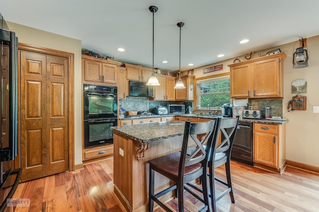 2800 Arbor Ln, Oswego, IL 60543 - kitchen with black appliances, light wood-style flooring, tasteful backsplash, and recessed lighting