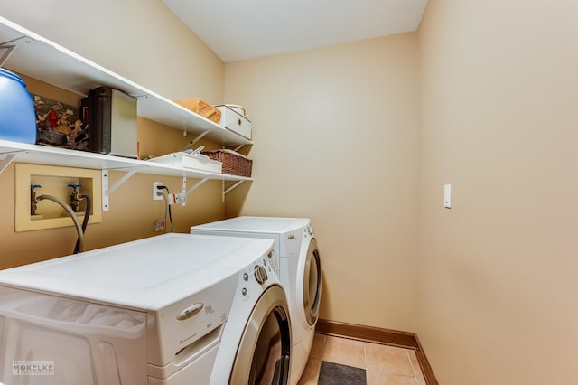 2800 Arbor Ln, Oswego, IL 60543 - laundry area with washer and clothes dryer and light tile patterned flooring