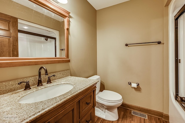 2800 Arbor Ln, Oswego, IL 60543 - bathroom featuring wood finished floors, a shower, and vanity