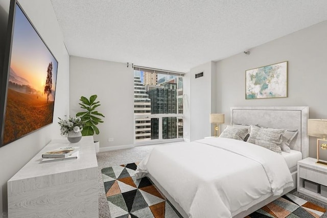 200 N Dearborn St Unit 2402, Chicago, IL 60601 - carpeted bedroom with a textured ceiling and baseboards