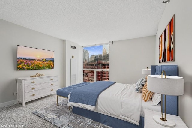 200 N Dearborn St Unit 2402, Chicago, IL 60601 - carpeted bedroom featuring a textured ceiling and baseboards