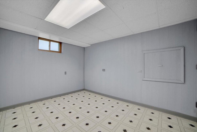 13610 S 84th Ave, Orland Park, IL 60462 - basement featuring tile patterned floors, a paneled ceiling, and wooden walls