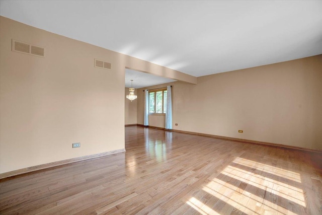 13610 S 84th Ave, Orland Park, IL 60462 - spare room with a chandelier and light wood-type flooring