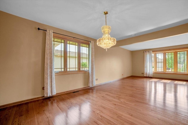 13610 S 84th Ave, Orland Park, IL 60462 - empty room with a chandelier and wood finished floors