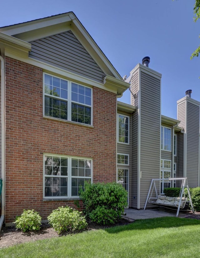 195 Island Ct Unit 195, Schaumburg, IL 60193 - back of property with a chimney and brick siding