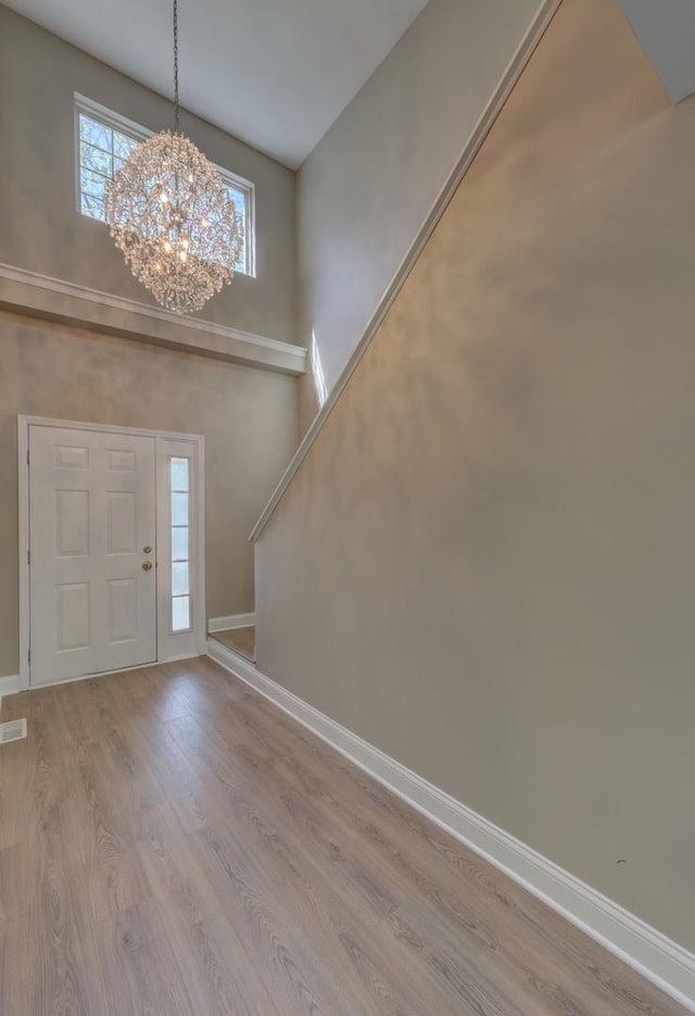 195 Island Ct Unit 195, Schaumburg, IL 60193 - entrance foyer with wood finished floors, a chandelier, and a towering ceiling