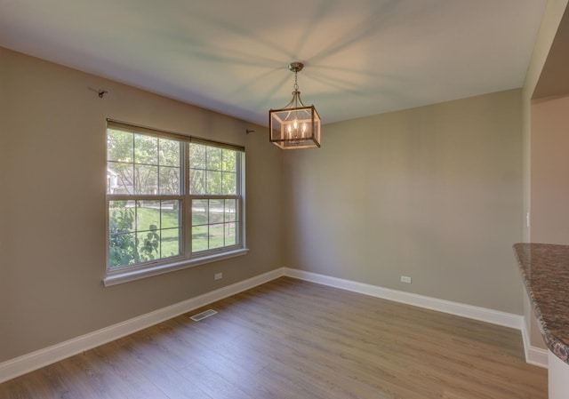 195 Island Ct Unit 195, Schaumburg, IL 60193 - unfurnished room with a chandelier and wood finished floors