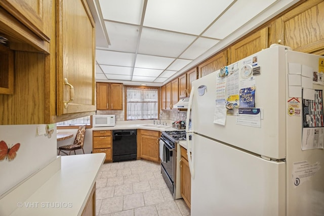 6419 Oak Forest Ave Unit 1N, Tinley Park, IL 60477 - kitchen featuring black appliances, light countertops, brown cabinets, backsplash, and a drop ceiling