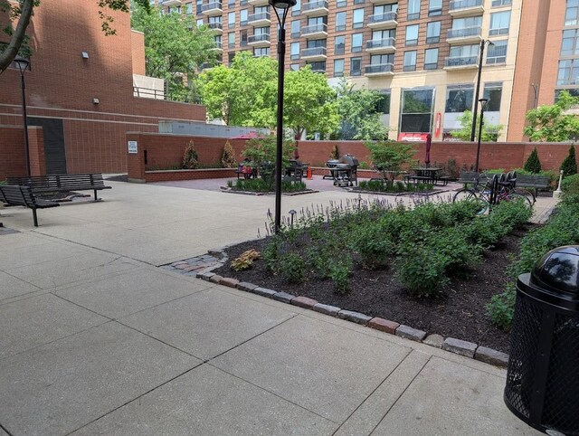 899 S Plymouth Ct Unit 1703, Chicago, IL 60605 - shared laundry with washer and clothes dryer and tile patterned floors