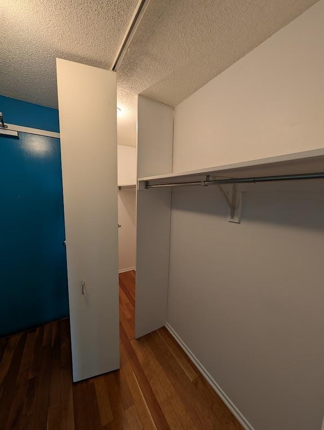 899 S Plymouth Ct Unit 1703, Chicago, IL 60605 - walk in closet with dark wood-style floors