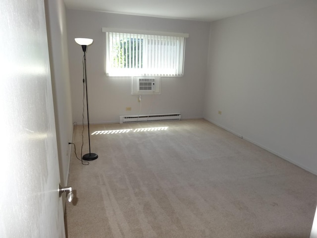 828 E Old Willow Rd Unit 109, Prospect Heights, IL 60070 - spare room with a baseboard radiator, carpet floors, and a wall mounted air conditioner