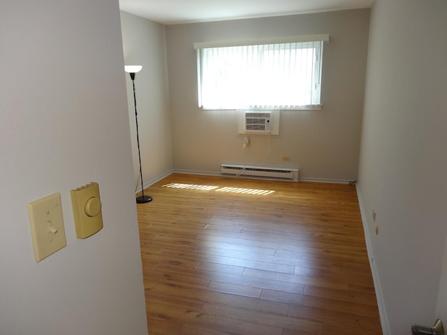828 E Old Willow Rd Unit 109, Prospect Heights, IL 60070 - unfurnished room with baseboard heating and wood finished floors