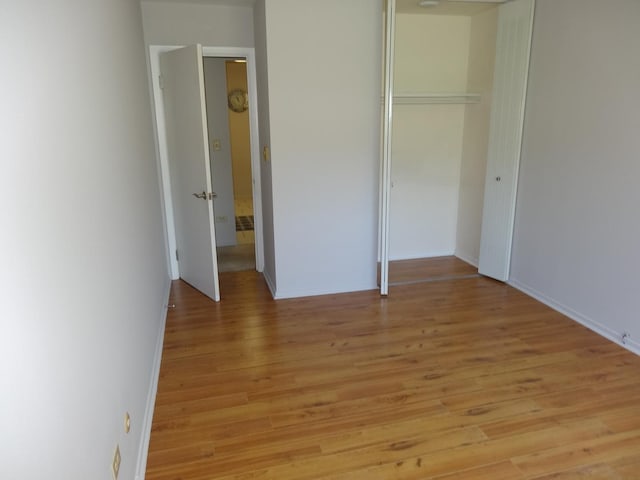 828 E Old Willow Rd Unit 109, Prospect Heights, IL 60070 - unfurnished bedroom featuring a closet and light wood-type flooring