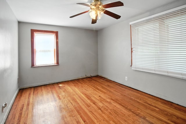 8619 S Jeffery Blvd, Chicago, IL 60617 - unfurnished room with wood finished floors and a ceiling fan