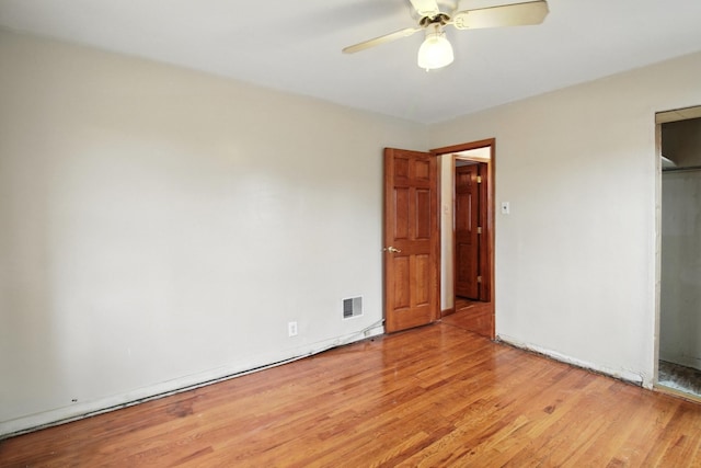 8619 S Jeffery Blvd, Chicago, IL 60617 - unfurnished bedroom with light wood finished floors and ceiling fan