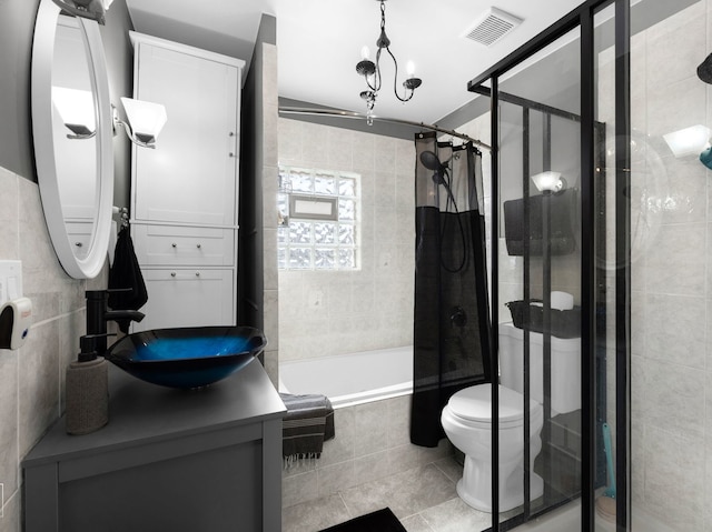 711 Illinois St, Lemont, IL 60439 - full bathroom with tiled shower / bath combo, vanity, tile patterned floors, and tile walls
