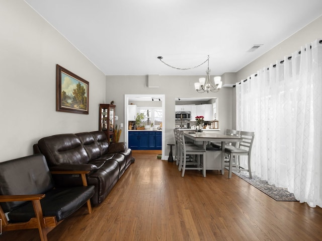 711 Illinois St, Lemont, IL 60439 - living area with a chandelier and dark wood-style floors