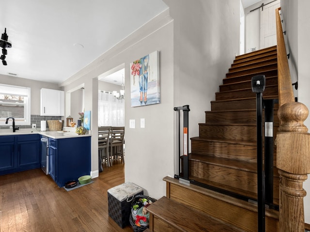 711 Illinois St, Lemont, IL 60439 - stairway featuring wood finished floors and a chandelier