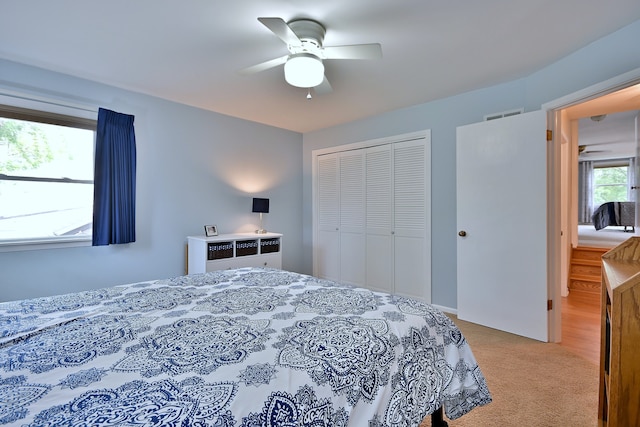 537 S Echo Ln, Palatine, IL 60067 - bedroom with a closet, light carpet, and ceiling fan