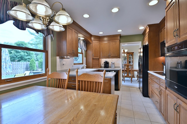 537 S Echo Ln, Palatine, IL 60067 - kitchen with black appliances, light countertops, plenty of natural light, light tile patterned flooring, and recessed lighting