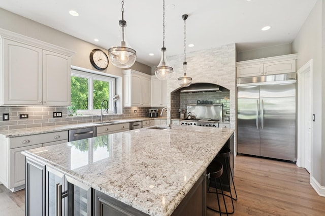 6N707 Brookhaven Ln, Saint Charles, IL 60175 - kitchen with appliances with stainless steel finishes, tasteful backsplash, light stone counters, and recessed lighting