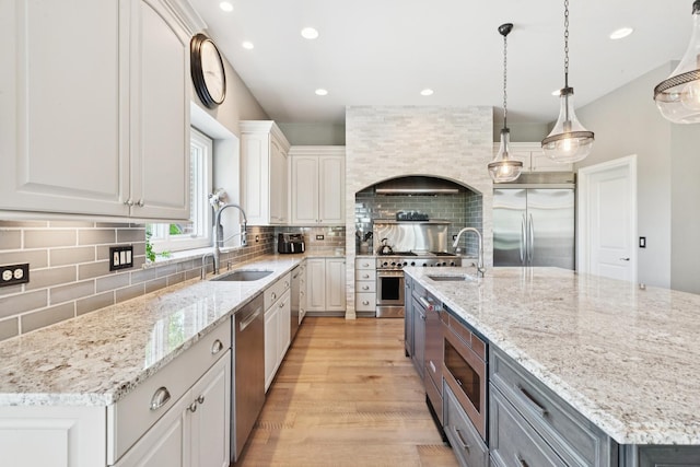 6N707 Brookhaven Ln, Saint Charles, IL 60175 - kitchen featuring built in appliances, a large island, recessed lighting, tasteful backsplash, and white cabinetry