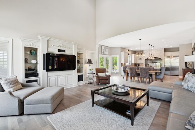 6N707 Brookhaven Ln, Saint Charles, IL 60175 - living room featuring a towering ceiling, light wood-style floors, recessed lighting, and a chandelier