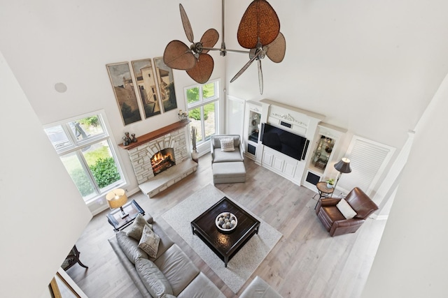 6N707 Brookhaven Ln, Saint Charles, IL 60175 - living area with a fireplace, a high ceiling, wood finished floors, and a ceiling fan