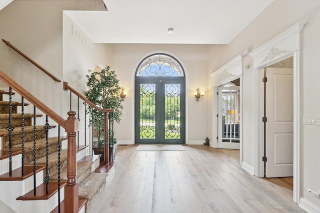 6N707 Brookhaven Ln, Saint Charles, IL 60175 - foyer with french doors, light wood-style floors, and stairs