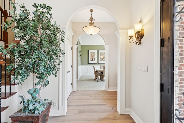 6N707 Brookhaven Ln, Saint Charles, IL 60175 - hall featuring arched walkways, light wood finished floors, and ornate columns
