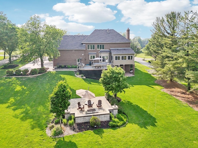 6N707 Brookhaven Ln, Saint Charles, IL 60175 - back of house with a patio, a lawn, and a chimney