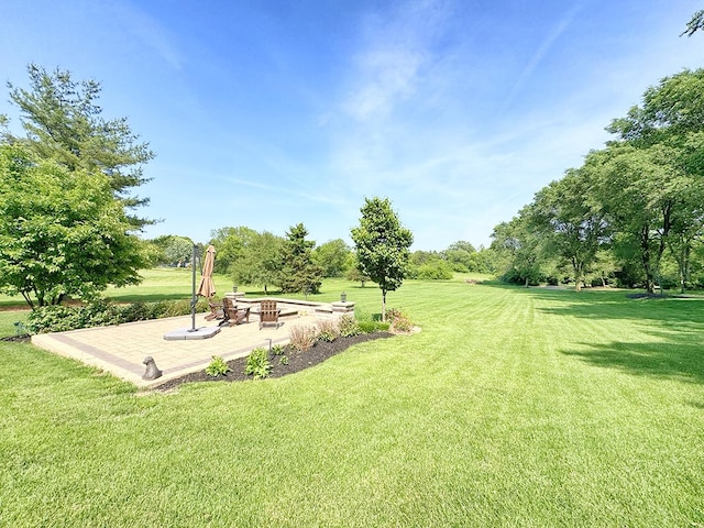 6N707 Brookhaven Ln, Saint Charles, IL 60175 - view of grassy yard featuring a patio area and a fire pit