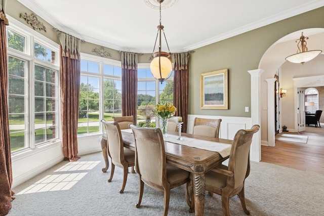6N707 Brookhaven Ln, Saint Charles, IL 60175 - dining area with arched walkways, healthy amount of natural light, light carpet, crown molding, and ornate columns
