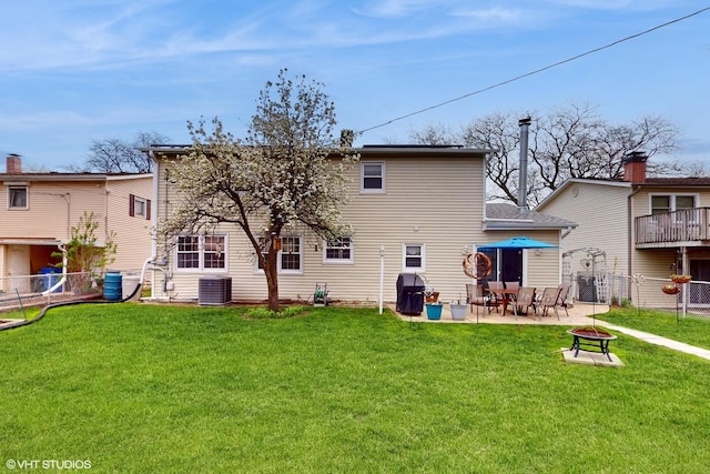 1416 S Robert Dr, Mount Prospect, IL 60056 - rear view of property with a fire pit, a fenced backyard, and a patio