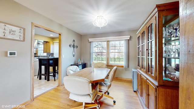 1416 S Robert Dr, Mount Prospect, IL 60056 - dining space with a chandelier, plenty of natural light, and light wood-type flooring