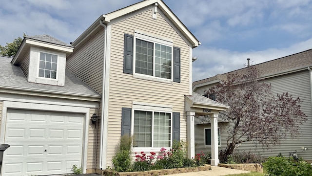 2434 Roxbury Ln, Montgomery, IL 60538 - traditional-style home with a garage and roof with shingles