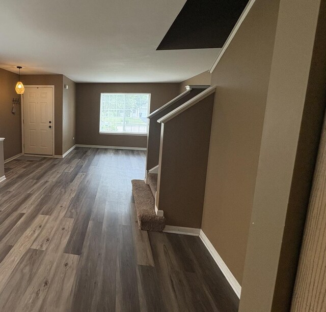 2434 Roxbury Ln, Montgomery, IL 60538 - corridor with stairway and wood finished floors